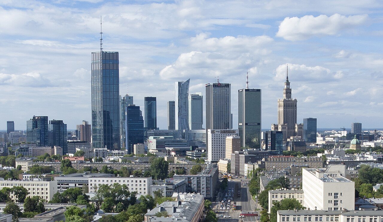 Aerial view along the stretch of Niepodległości (Independence) Avenue in Warsaw from north of the intersection with the Łazienkowski Route (Wawelska Street / People's Army Avenue) and Koszykowa. In the background are the tall buildings of the city ce